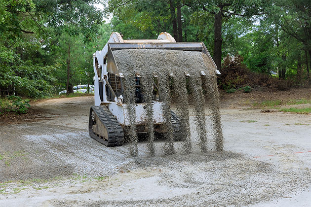 Skidsteer Dumping Gravel in McGregor MN